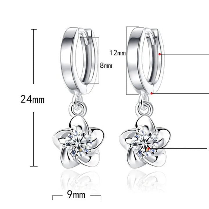 Srebrne naušnice s ljubičastim cvijetom i kristalom